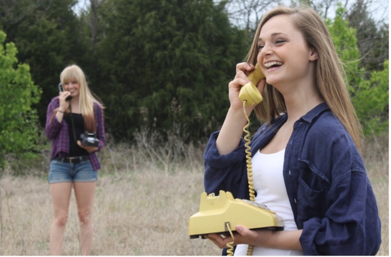 two girls talking on old fashioned phones