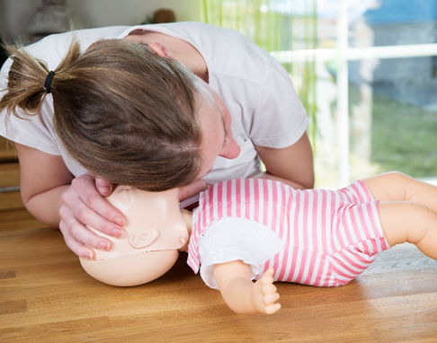 Carer listens to baby breathing